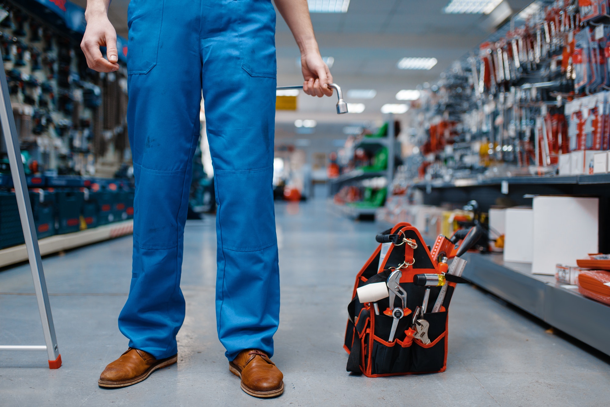 Toolbox in tool store, worker on background